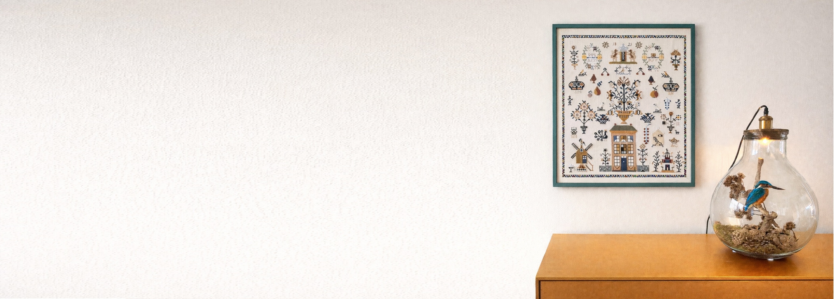 Detail of traditional Dutch cross-stitch embroidery with floral patterns